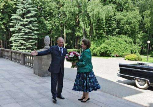 Russia's President Vladimir Putin with cosmonaut Valentina Tereshkova, at his  residence outside Moscow, on June 14 2013