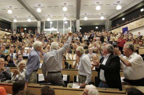 Scientists applaud during a seminar at CERN facility in Meyrin, near Geneva, on July 4, 2012