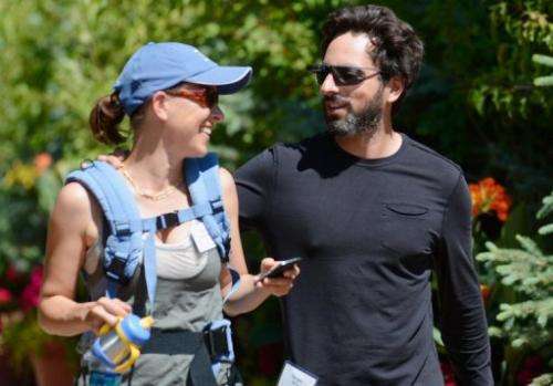 Sergey Brin (R), co-founder of Google, and wife Anne Wojcicki attend a conference on July 12, 2012, in Sun Valley, Idaho