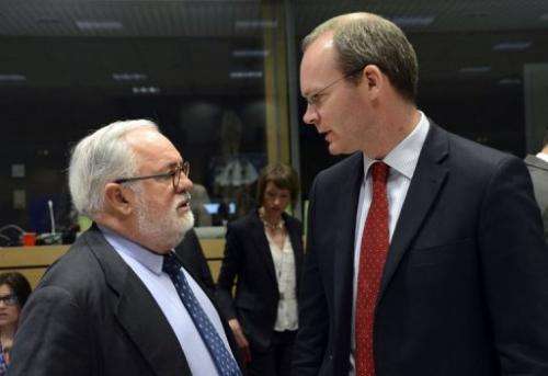 Simon Coveney (R) talks to Miguel Arias Canete in Brussels on May 13, 2013