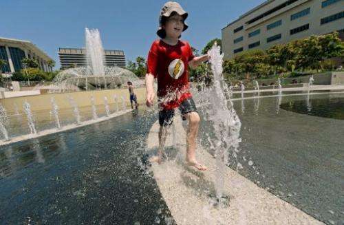 Simon Lunsford, 9, cools off in the Arthur J. Will Memorial Fountain in Los Angeles on June 28, 2013