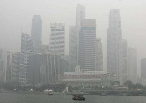 Singapore's skyscraper is seen enveloped in smog on October 16, 2006 from forests fires in Indonesia