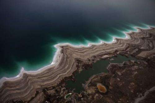 Sinkholes created by the drying of the Dead Sea are pictured near Kibbutz Ein Gedi on November 10, 2011