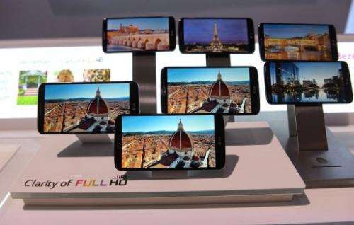 Smartphones on display during a global launch event in New York on, August 7, 2013