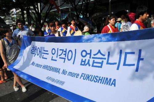 South Korean activists carry a banner reading &quot;No more Hiroshima, No more Fukushima,&quot; during an anti-nuclear protest i
