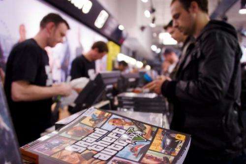 Staff sells the console game Grand Theft Auto 5 at the HMV music store in central London on September 17, 2013