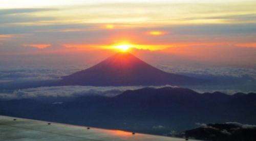 Sun rises behind Mount Fuji early on January 1, 2012