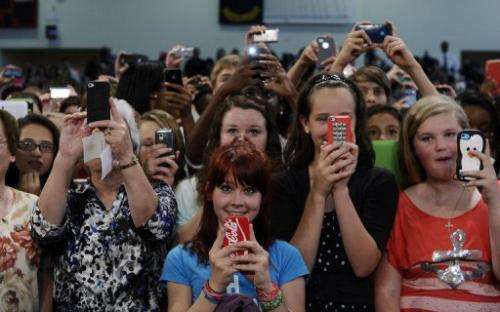 Teachers and students shoot photos and videos with their smartphones in Mooresville, North Carolina, on June 6, 2013