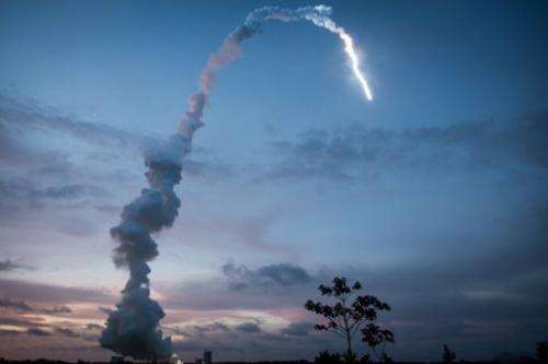 The Ariane 5 blasts off from the ground at the French Guyana European Spaceport of Kourou on June 5, 2013