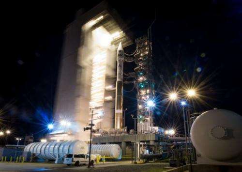 The Atlas-V rocket with Landsat Data Continuity Mission spacecraft onboard is revealed on February 11, 2013