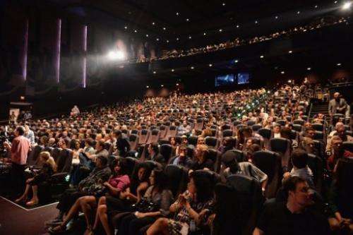 The audience applauds after a show at Regal Cinemas, Los Angeles, California, June 17, 2013