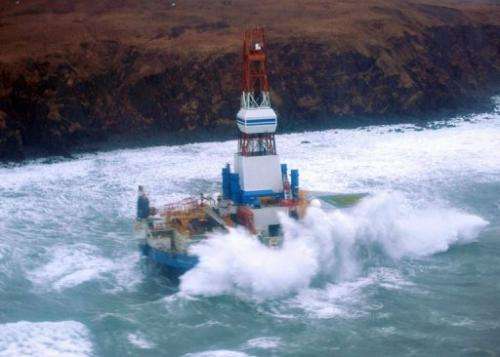 The conical mobile drilling unit Kulluk aground on the southeast side of Sitkalidak Island, Alaska, January 1, 2013