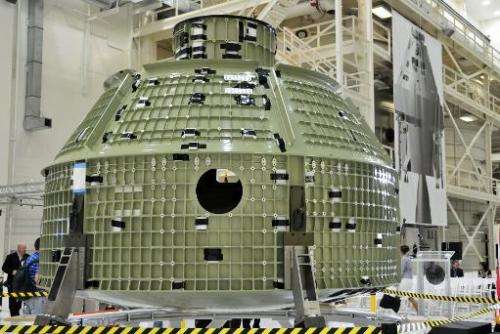 The first flight shell of NASA's new Orion spacecraft is presented to invited guests and the media inside the Operations and Che