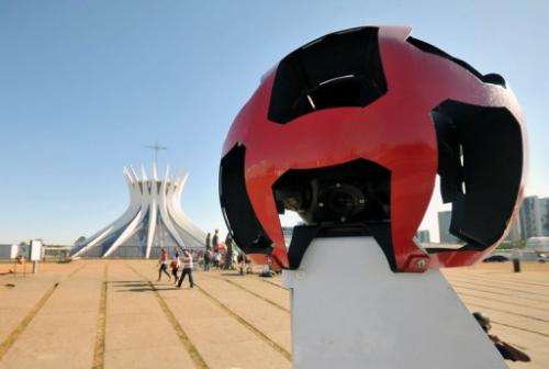 The Google street view mapping and camera vehicle drives in front of Brasilia's cathedral on September 6, 2011