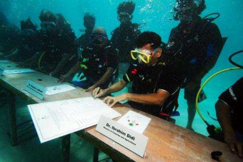 The Maldives government holds a cabinet meeting under water on October 17, 2009 to highlight the threat of rising sea levels