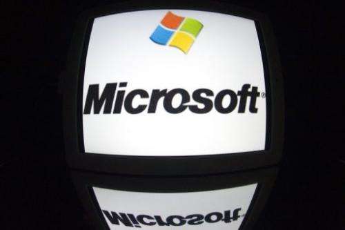 The "Microsoft" logo is seen on a tablet screen on December 4, 2012 in Paris
