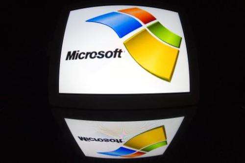 The &quot;Microsoft&quot; logo is seen on a tablet screen on December 4, 2012 in Paris