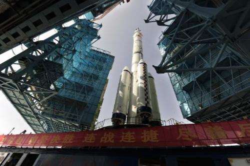The Shenzhou X spacecraft carried by a Long March-2F carrier rocket is installed at the launch pad in Jiuquan, Northwest China's