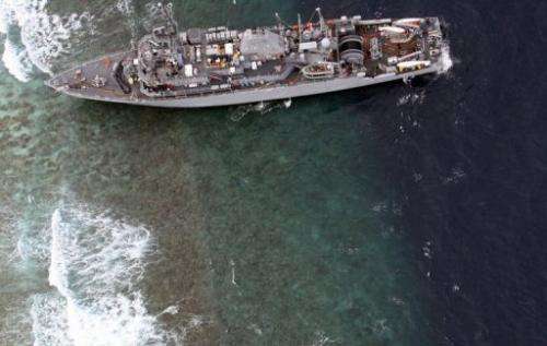 The USS Guardian is seen here on January 17, 2013 after it ran aground on the Tubbataha Reef in the Philippines