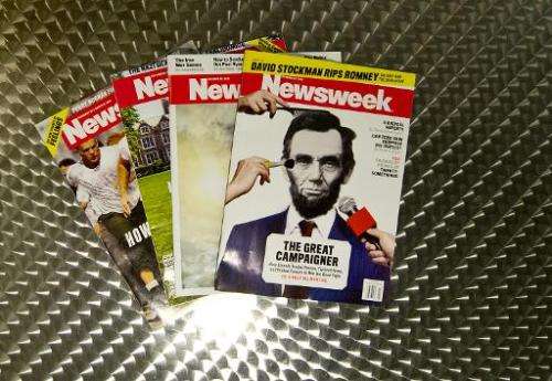 This October 18, 2012 photo illustration shows copies of Newsweek magazine in Washington, DC