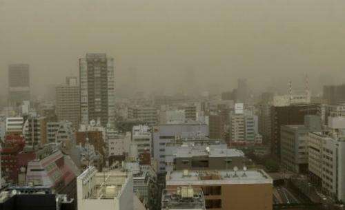Tokyo's Ginza shopping district is hit by a dust storm on March 10, 2013