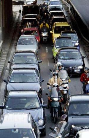 Traffic during a rush-hour is seen on a street of Rome on January 30, 2004