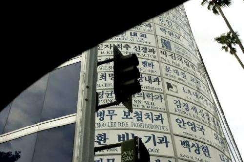 Traffic signals and advertisements are pictured from inside an automobile in Los Angeles on April 27, 2005