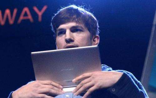 US actor Ashton Kutcher presents Lenovo's first multi mode Yoga Tablet on October 29, 2013 in Los Angeles