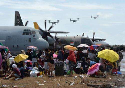 US Marine Osprey aircraft arrive to deliver aid at Tacloban airport after Typhoon Haiyan hit the east coast of the Philippines, 