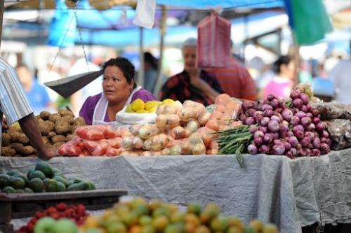 Vendors sell fruits and vegetables at the El Mayoreo street market in Tegucigalpa on October 6, 2012