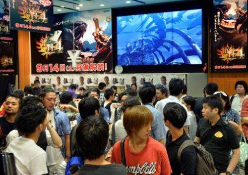 Videogame fans queue up to buy 'Monster Hunter 4' in Tokyo on September 14, 2013