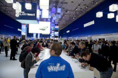 Visitors try out Samsung's Galaxy Note II tablet at the IFA trade fair in Berlin on August 31, 2012