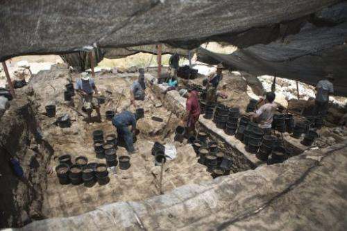 Volunteers from Hebrew University work at an excavation at the Israeli archeological site of Tel Hazor, on July 9 2013