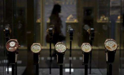 Watches by Swiss watchmaker Jacquet Droz are displayed on the opening day of watch fair Baselworld on April 25, 2013