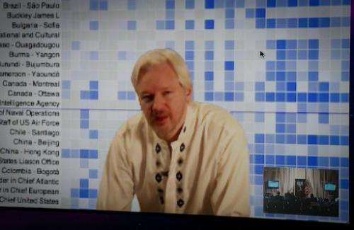 WikiLeaks founder Julian Assange speaks during a teleconference between London and Washington on April 8, 2013