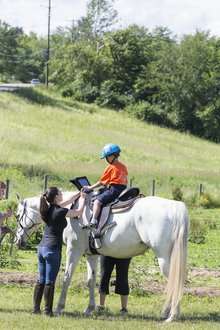 With horses and iPads, autistic children learn to communicate