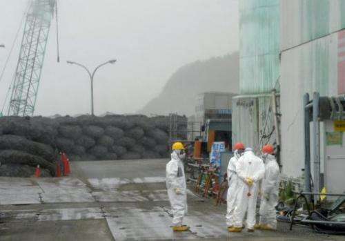 Workers take a break at Japan's Fukushima Dai-ichi nuclear plant in Okuma town in Fukushima prefecture on June 12, 2013