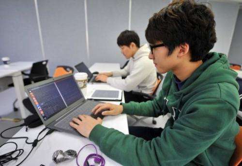 Young computer experts are pictured at the Korea Information Technology Research Institute in Seoul on February 14, 2013