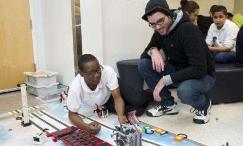 Young engineers build a robotic bridge to reach seniors
