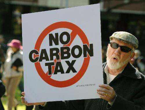 A demonstrator shouts slogans during a protest against a carbon tax in Sydney on July 1, 2012