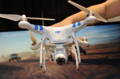 A DJI Innovations DJI Phantom 2 Vision aerial system drone is shown during &quot;CES: Unveiled,&quot; the media preview for Inte