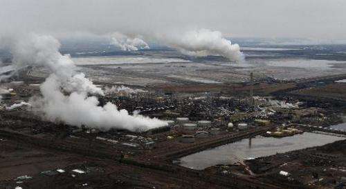 Aerial view of the Syncrude oil sands extraction facility with the Suncor extraction facility in the background, in Alberta Prov