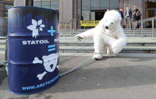 A Greenpeace activist in a polar bear costume protests outside Norwegian company Statoil's office in Moscow on April 25, 2013 ag