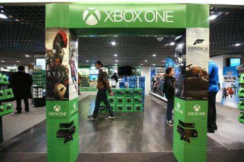 An adverstising gate presenting the new XBox One game console is pictured in a store in Paris on November 22, 2013