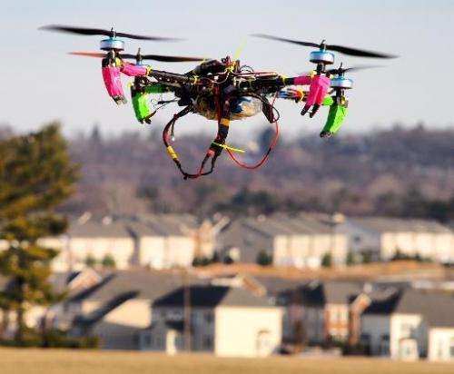 A small remote-controlled drone hovers in the sky at the DC Area Drone User Group meet-up on February 1, 2014