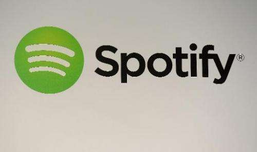 A Spotify logo is seen at a press conference in New York, December 11, 2013