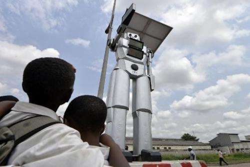 A traffic robot cop is seen on Triomphal boulevard in Kinshasa, at the crossing of Asosa, Huileries and Patrice Lubumba streets,