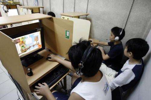 Children playing computer games in Singapore, on December 28, 2006