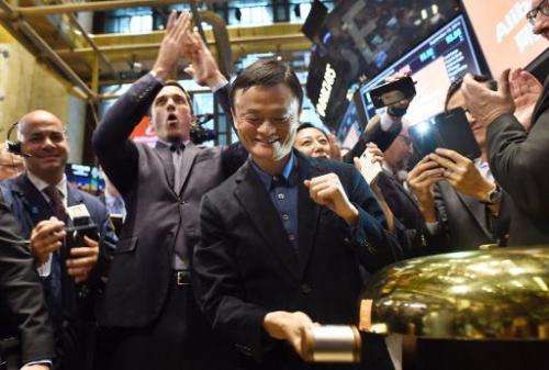Chinese online retail giant Alibaba founder Jack Ma (C) opens trading on the floor of the New York Stock Exchange on September 1