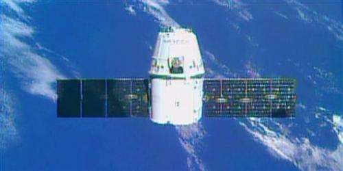 Dragon arrives at space station with 3-D printer